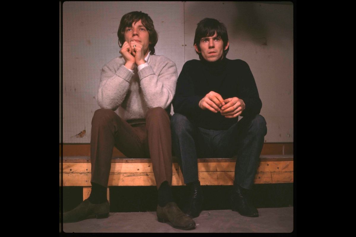 Guitarist Keith Richards (R) and vocalist Mick Jagger of rock & roll group The Rolling Stones on the set of music programme Ready Steady Go! in London, circa 1964