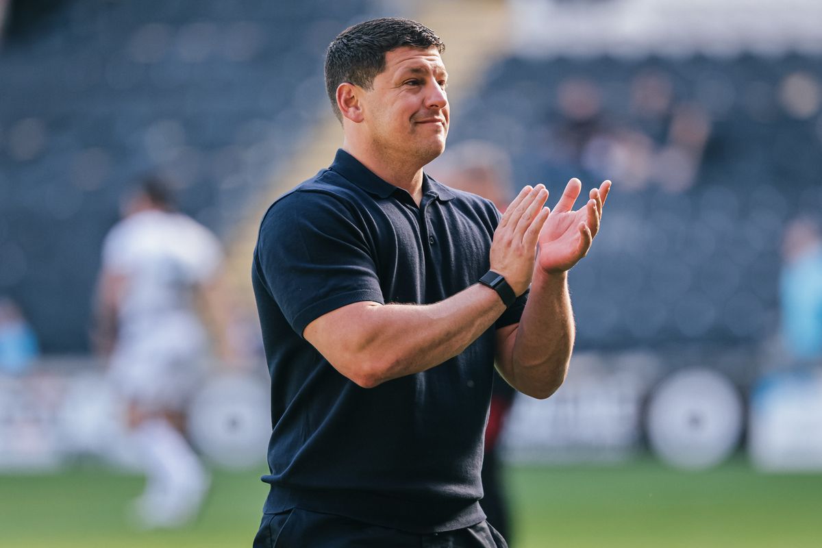 Wigan head coach Matt Peet celebrates the win at Hull FC.