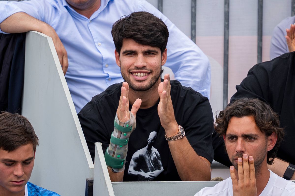 Carlos Alcaraz while watching his brother, Jaime Alcaraz, compete against Poi Mas Tabuena during the Mutua Madrid Open Sub-16 event.
