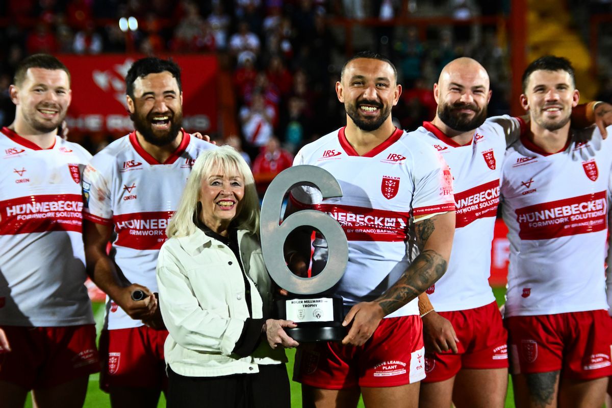 Hull KR captain Elliot Minchella is presented the Roger Millward MBE Trophy