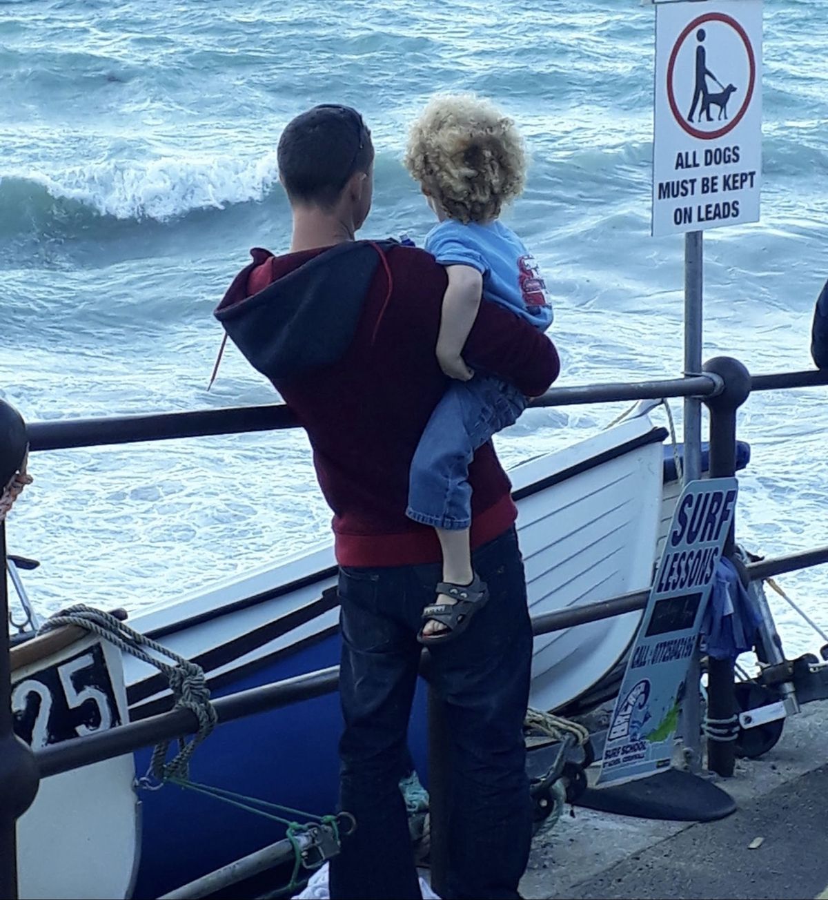Ryan and child looking out at sea