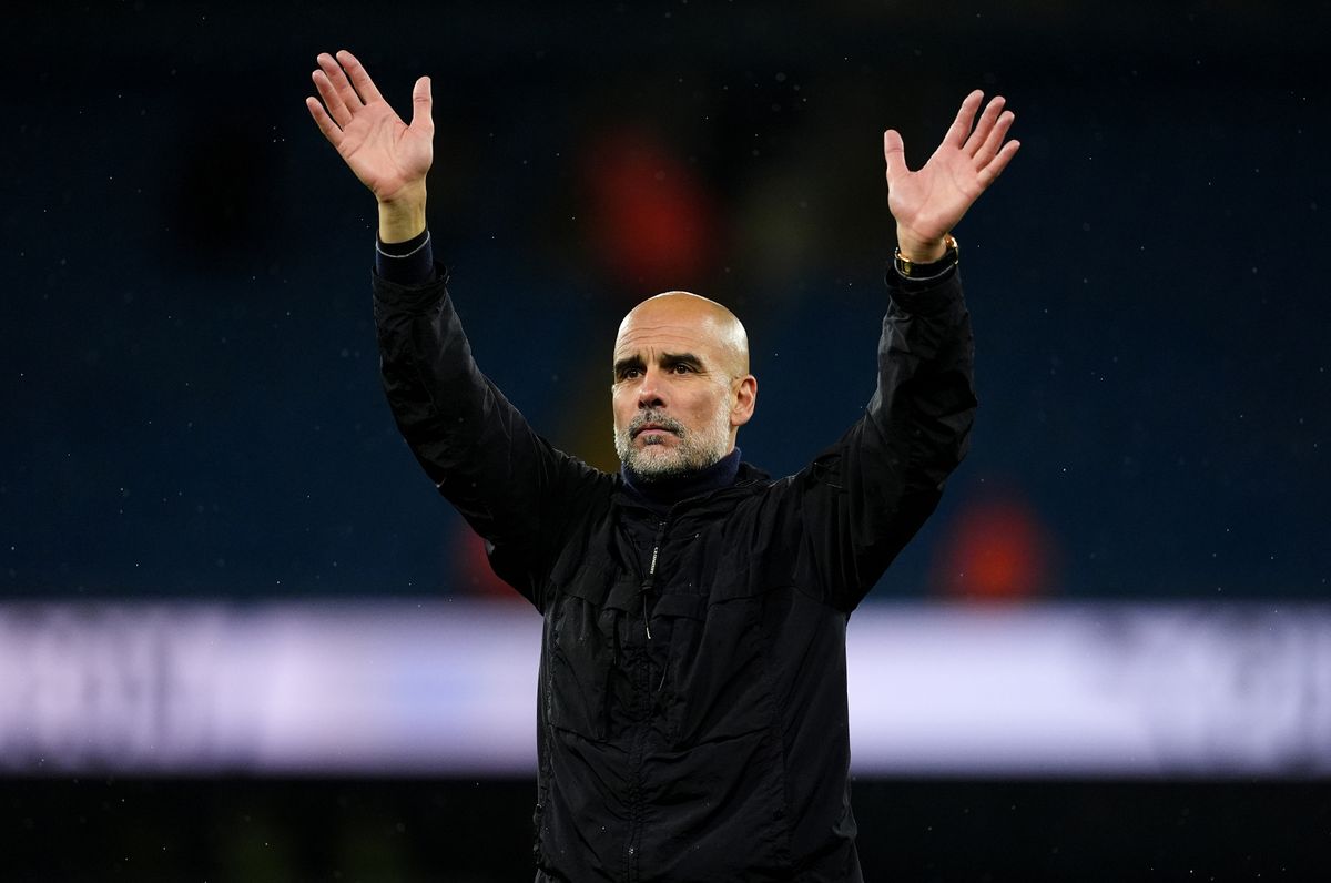 Pep Guardiola raises his hands