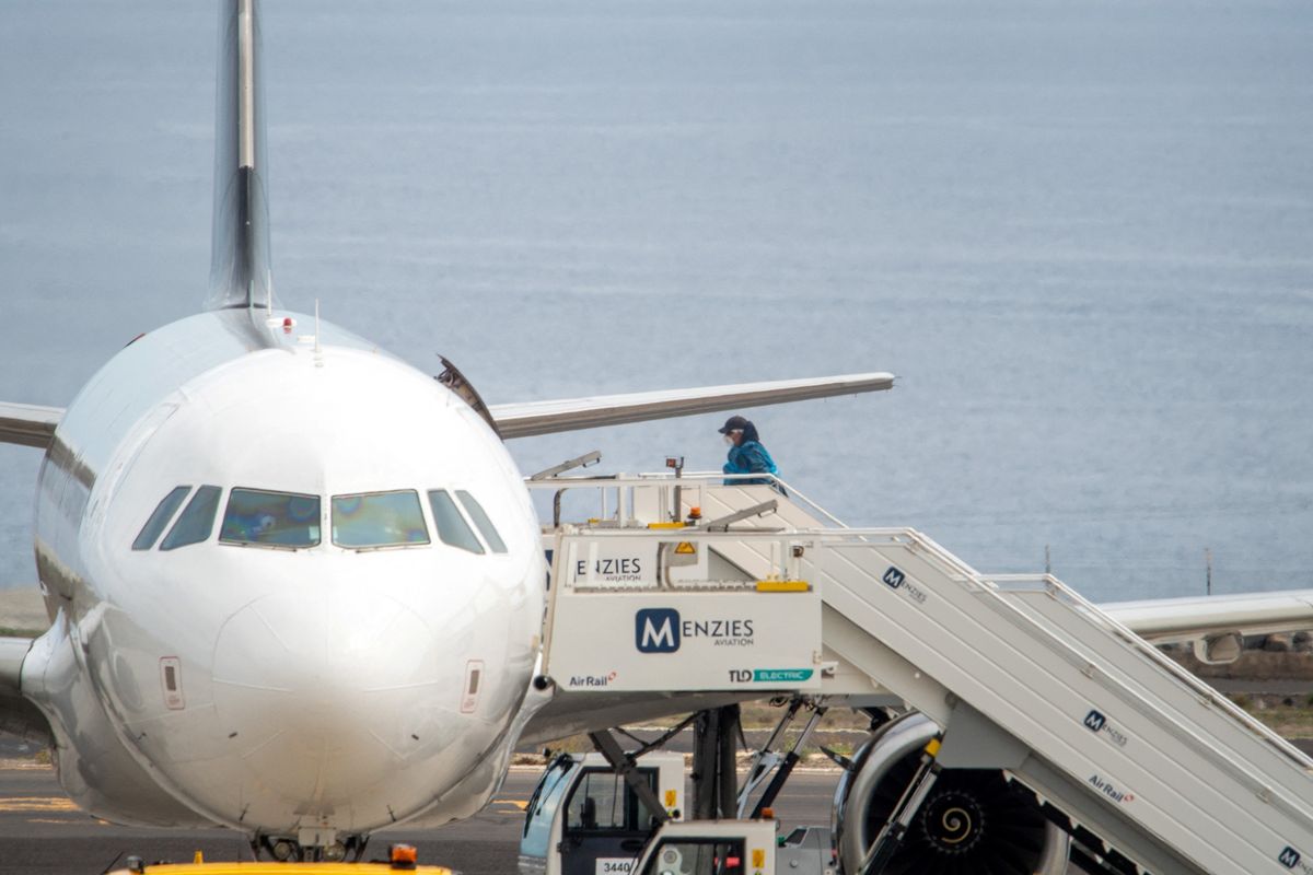 Person boards a plane