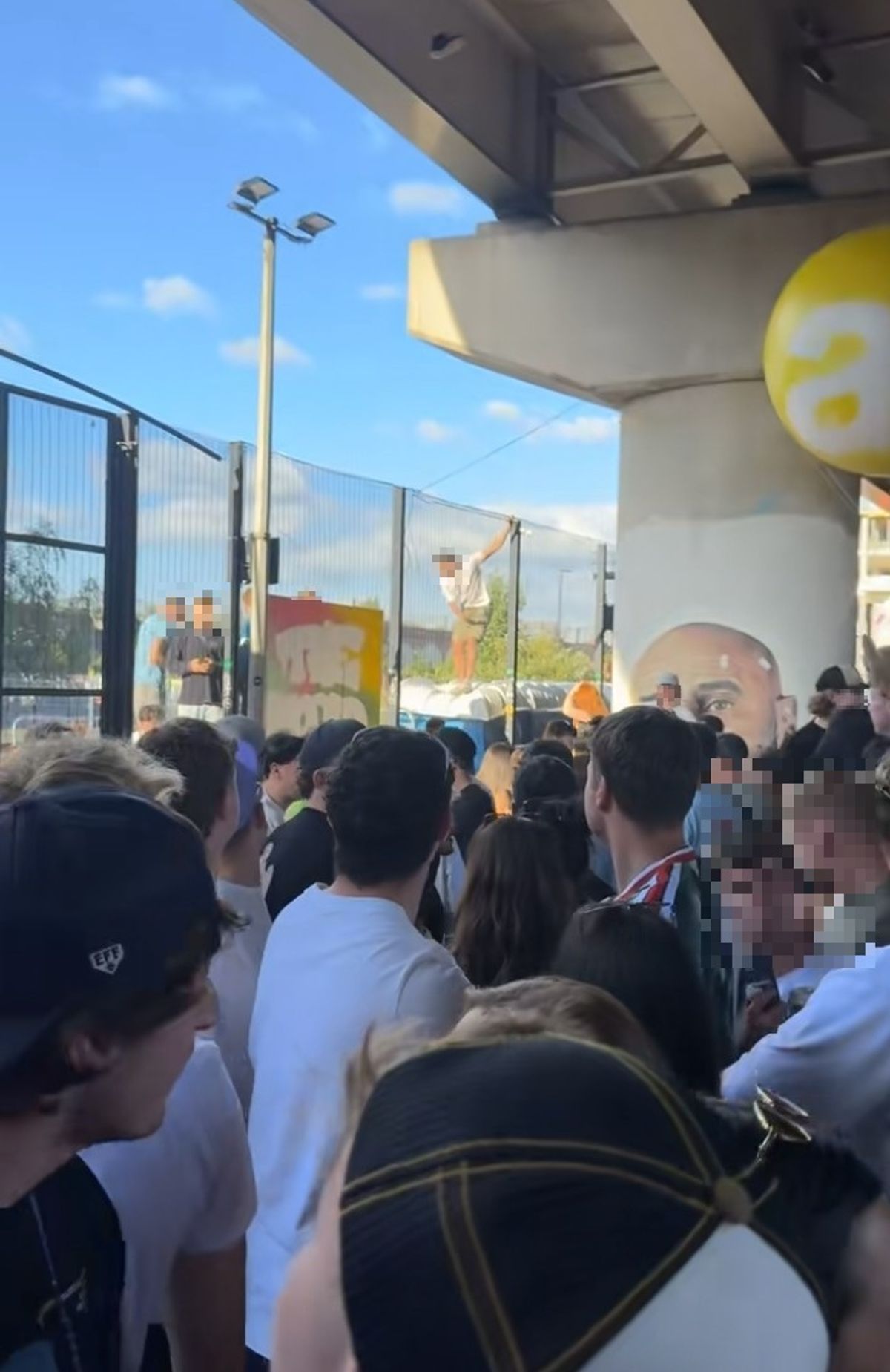 People were seen using the toilet cubicle roofs outside to get over the fence