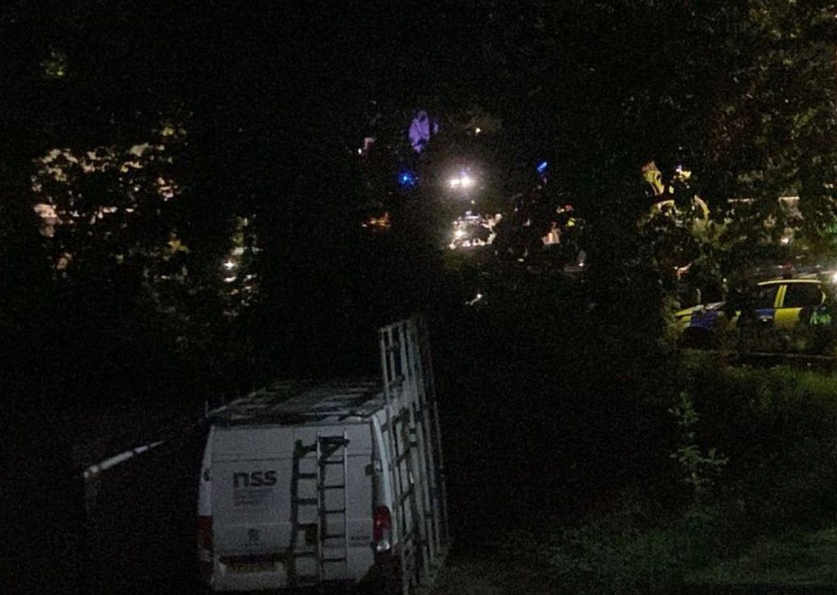 A police car can be seen on the right of the image close to Northfield train station