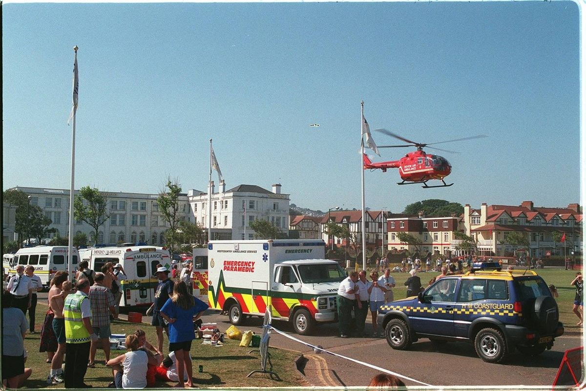 The air ambulance is called to Paignton Beach after a razor-fish alert which injured over 1000 people