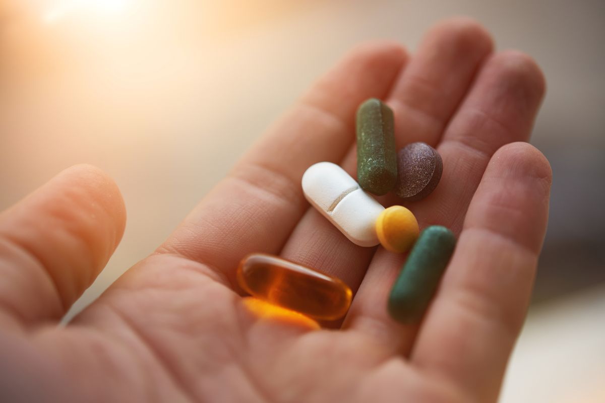 Man holding supplements