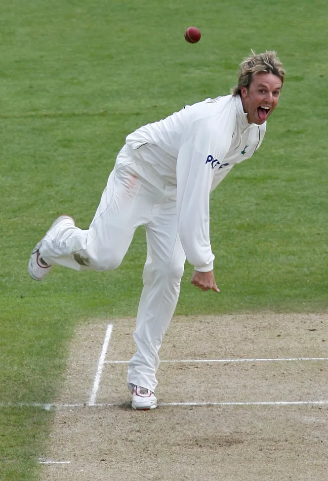 Graeme Swann bowls for Nottinghamshire during a cricket match against Surrey.
