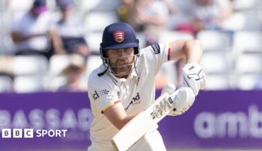 Essex batter Matt Critchley intently watching the ball as he knocks it into the offside