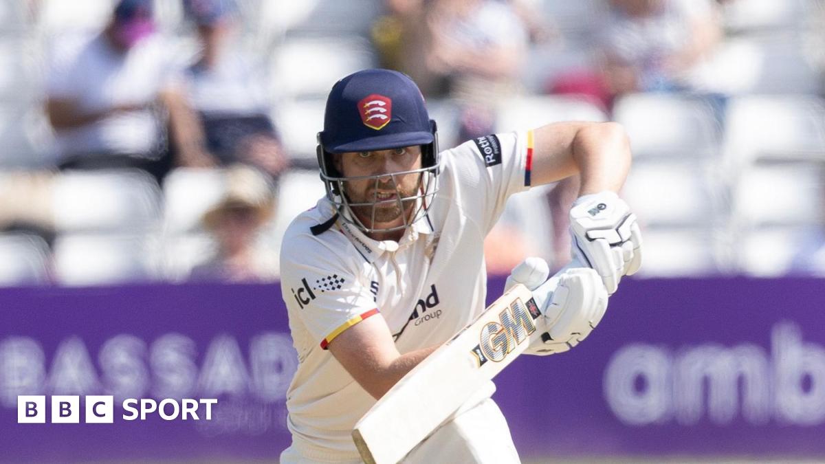 Essex batter Matt Critchley intently watching the ball as he knocks it into the offside