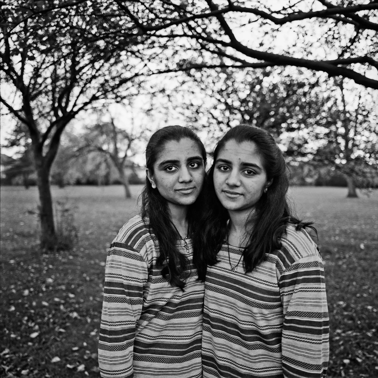 Jigna and Jilpa, two young women, posing outdoors in Middlesex.