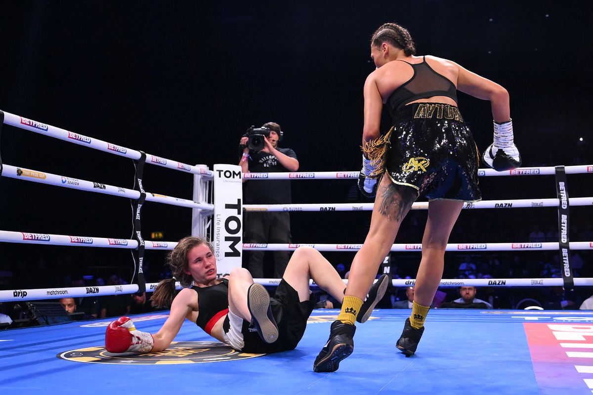 Tiah Mai Ayton knocks down Sara Orszagi during the Women's Super Bantam weight fight between Tiah Mai Ayton and Sara Orszagi at BP Pulse Live