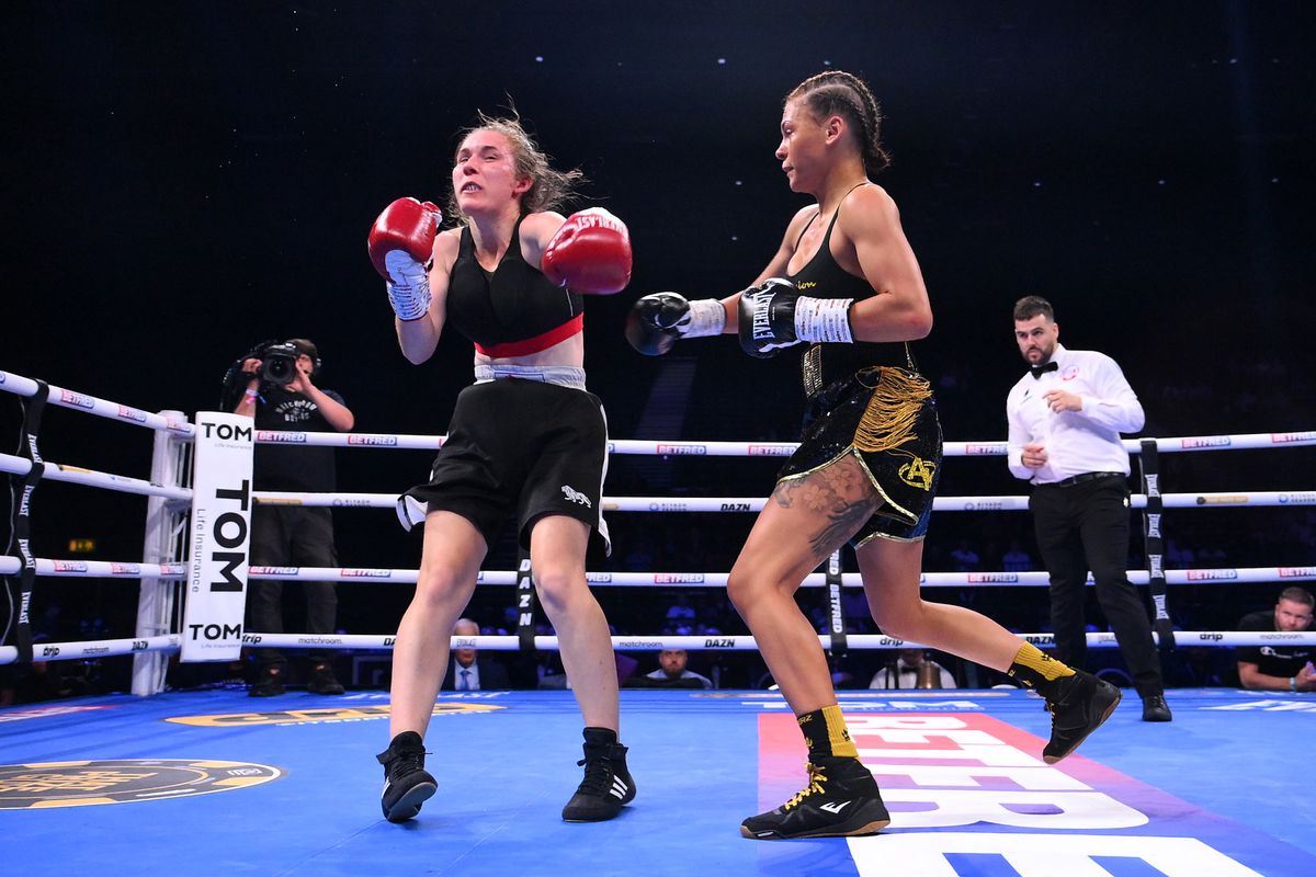 Tiah Mai Ayton knocks down Sara Orszagi during the Women's Super Bantam weight fight
