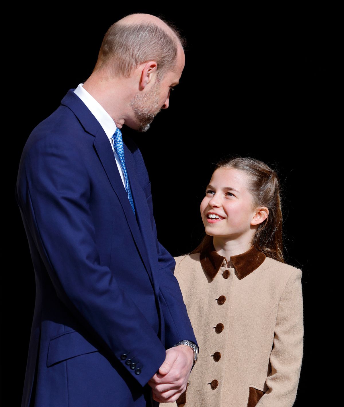 Charlotte smiles at dad Prince William