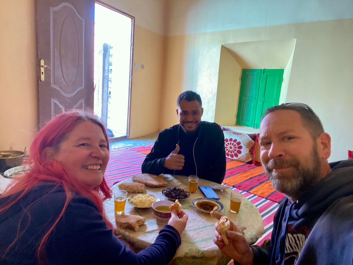 Three people at a table eating