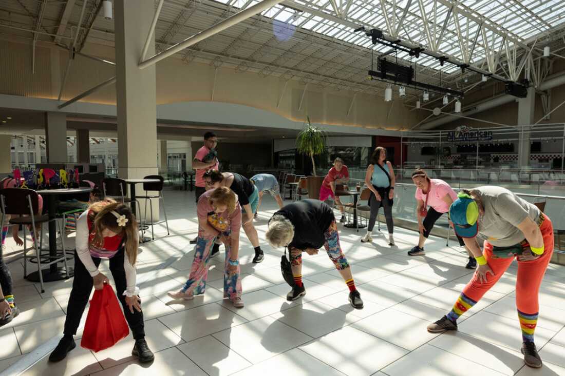 The Food Court 5000 mall walkers stretch before starting their rounds at the Lloyd Center food court on Sunday, April 26, 2026 in Portland, Oregon.