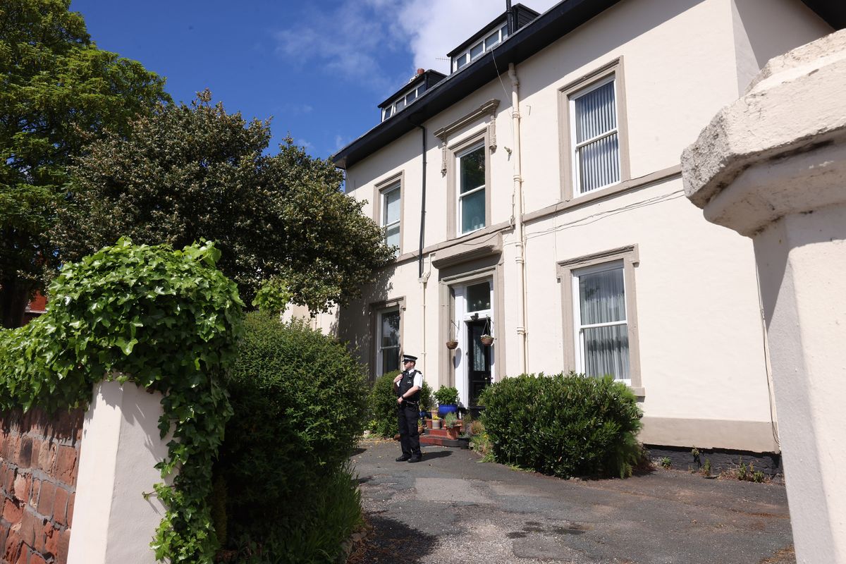 Officers guarded the property as forensics searched inside