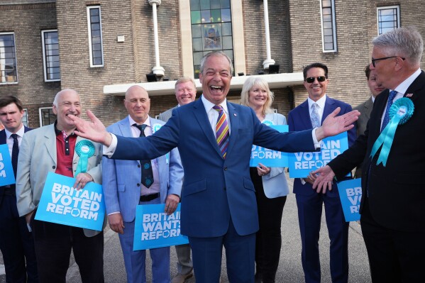 Reform UK leader Nigel Farage poses for a photo during a visit to Havering Town Hall, in Romford, England, Friday May 8, 2026, a day after the local elections. (Yui Mok/PA via AP)