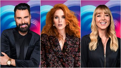 A collage of head and shoulders shots of Rylan, Angela Scanlon and Sara Cox, set against a background of blue, pink and purple Eurovision hearts