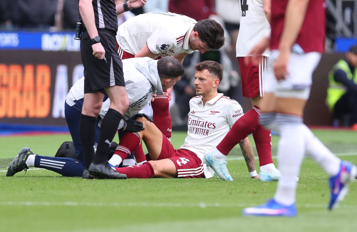 Ben White receives medical treatment during an Arsenal game