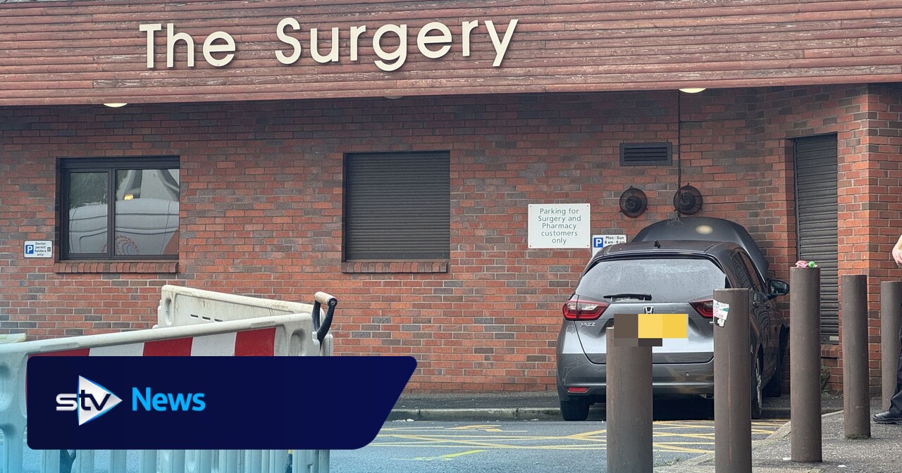 GP surgery and pharmacy evacuated after car crashes into building