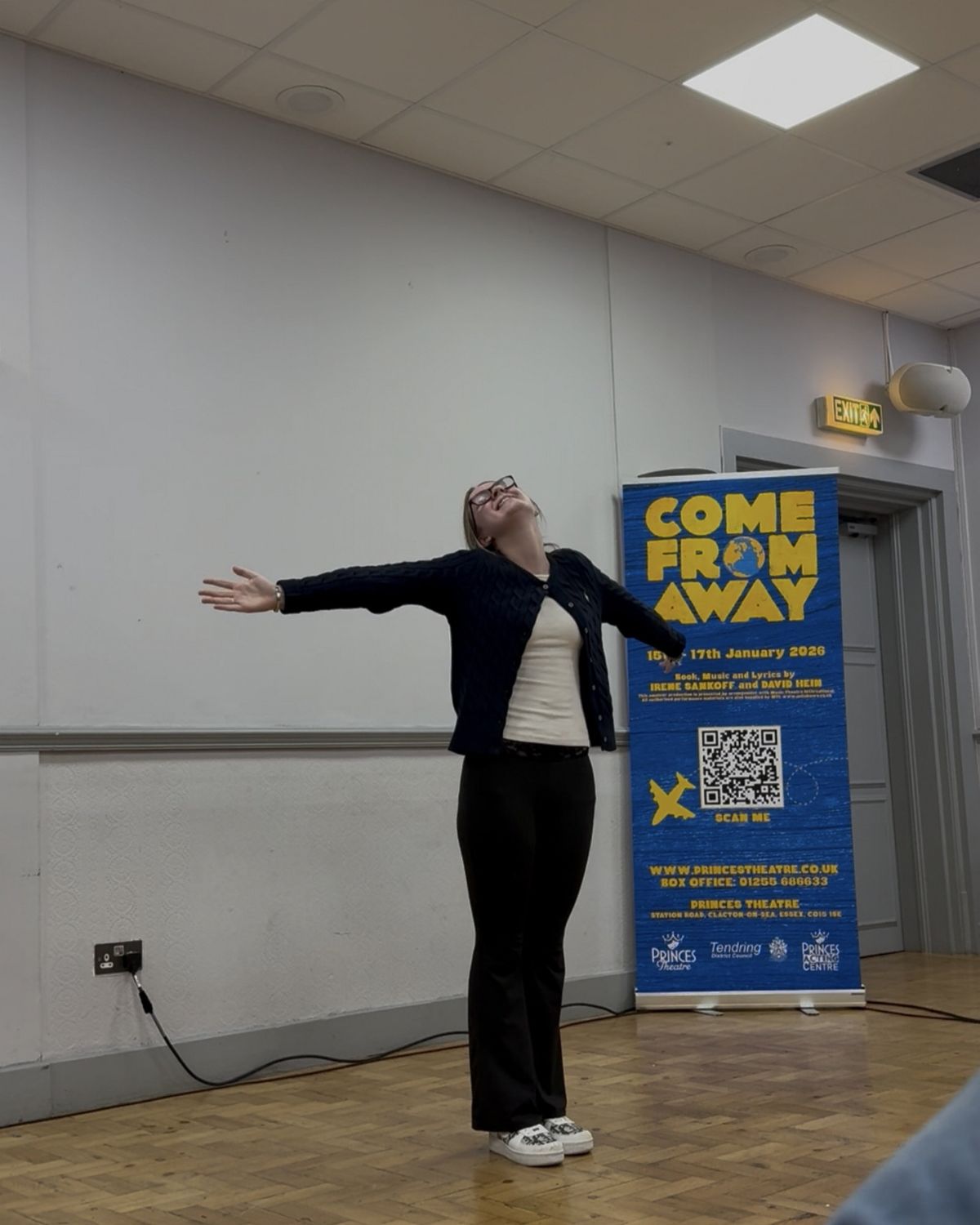 Lexi Brown with arms outstretched