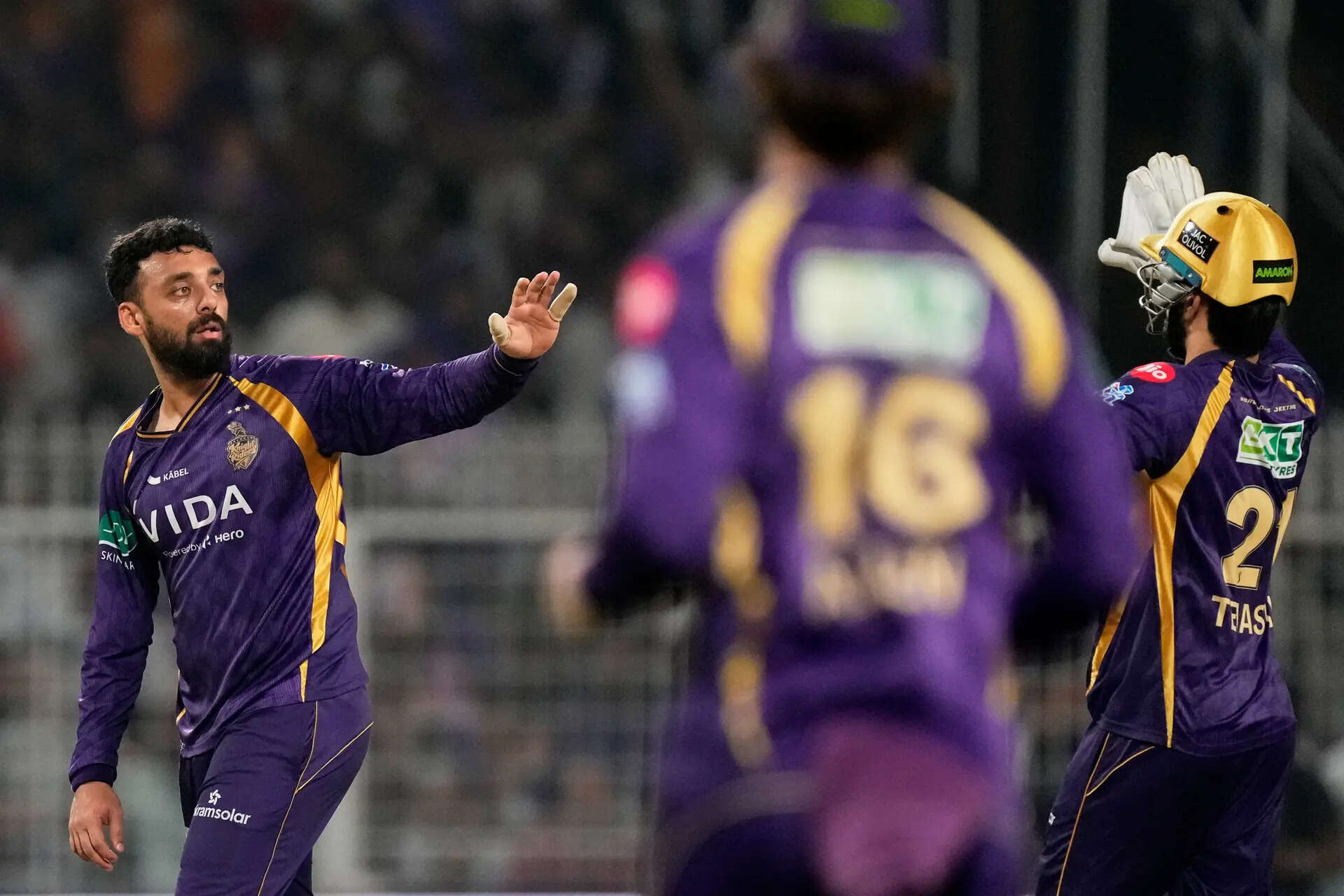 Kolkata Knight Riders' Varun Chakaravarthy celebrates with teammates the wicket of Delhi Capitals' captain Axar Patel during the Indian Premier League. (AP Photo) India IPL Cricket