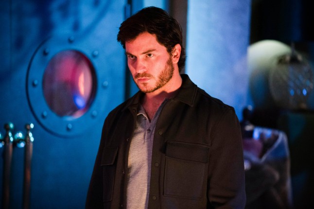 Gray standing in the club looking evil in EastEnders