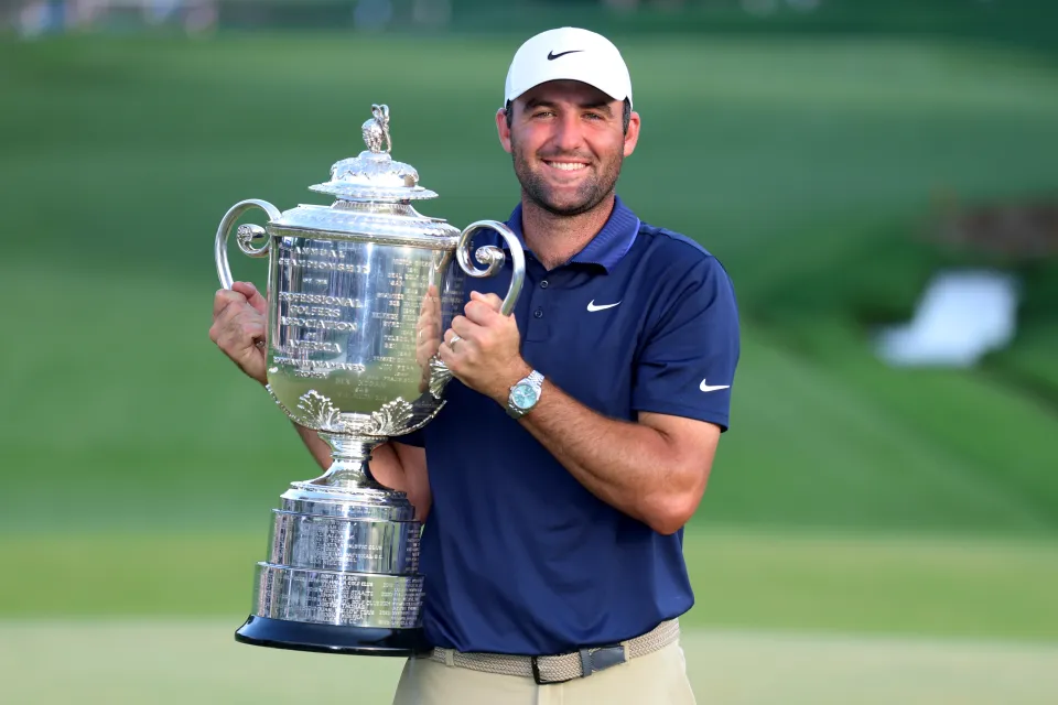 Defending champion Scottie Scheffler holds the Wanamaker Trophy following his victory during the final round of the 2025 PGA Championship