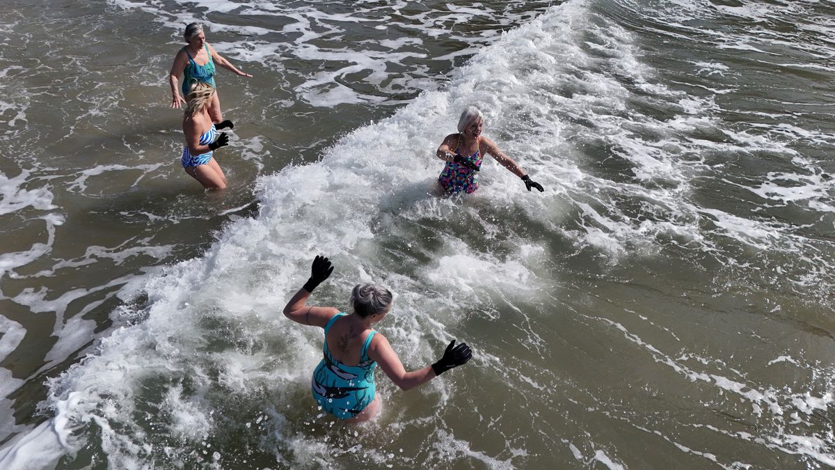 A group of women doing a cold-water dip
