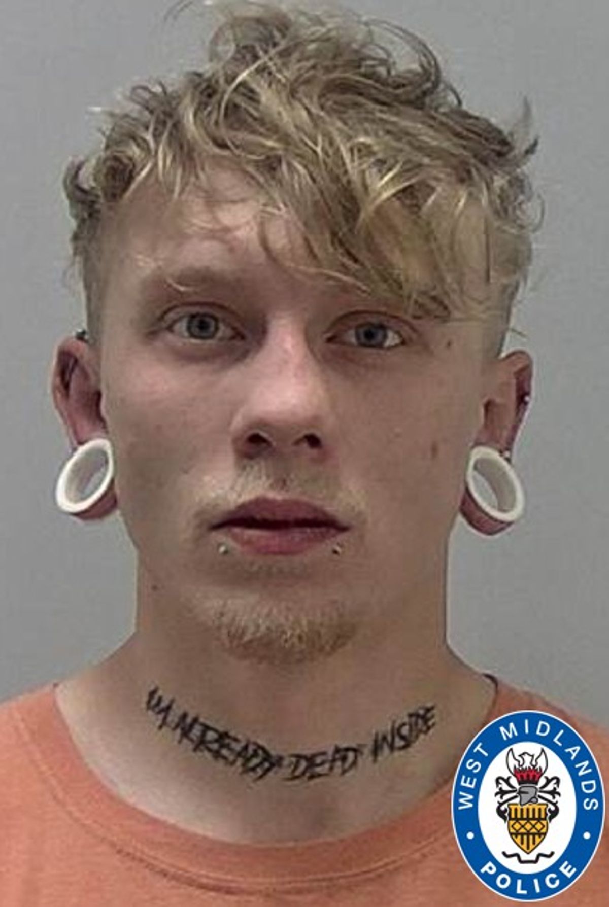 Photo of Cameron Rosenwink who is, 30, white and has short, blonde hair, pictured with two white ‘plug’ gauge body piercings in his ears and has a tattoo on his neck in black and capital letters, which states ‘I’m Already Dead Inside’
