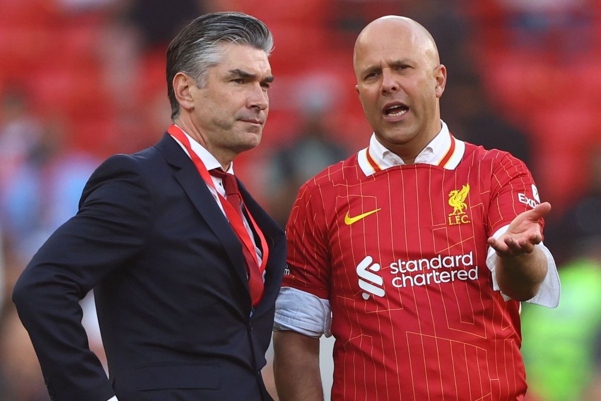 Liverpool manager Arne Slot (right) speaks with sporting director Richard Hughes after winning the Premier League title