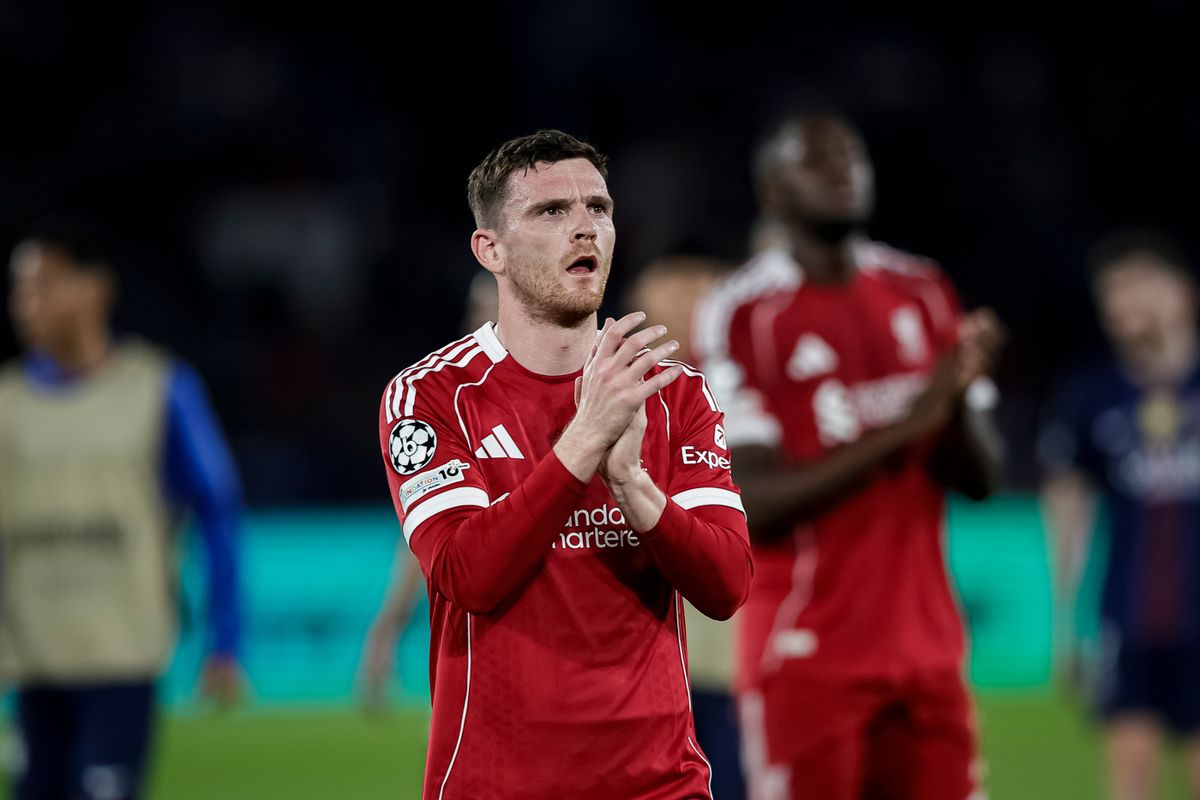 Andy Robertson claps the fans