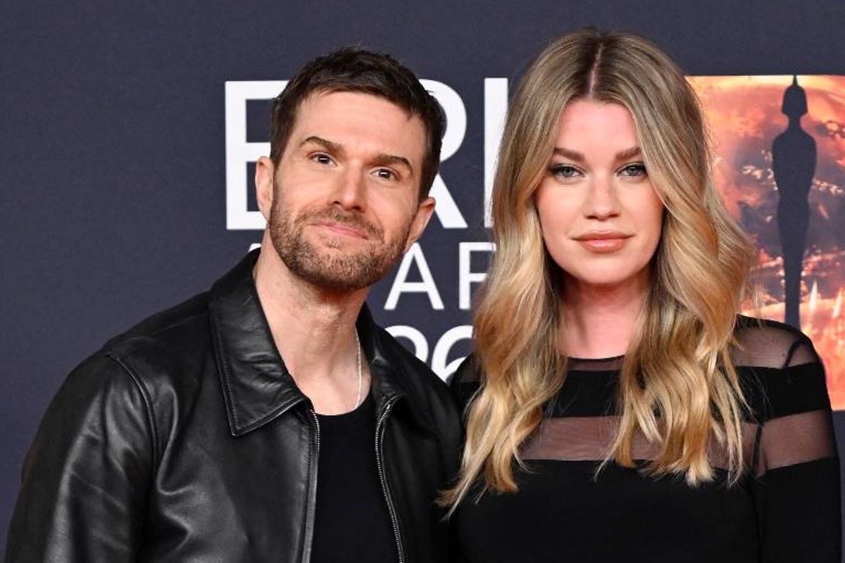 hannah and joel dommett in black on red carpet at brits