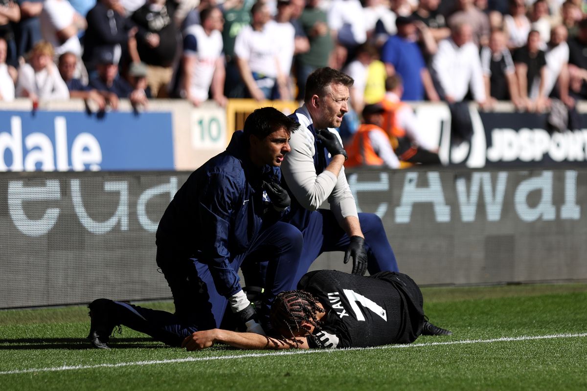 Xavi Simons receives treatment on the pitch