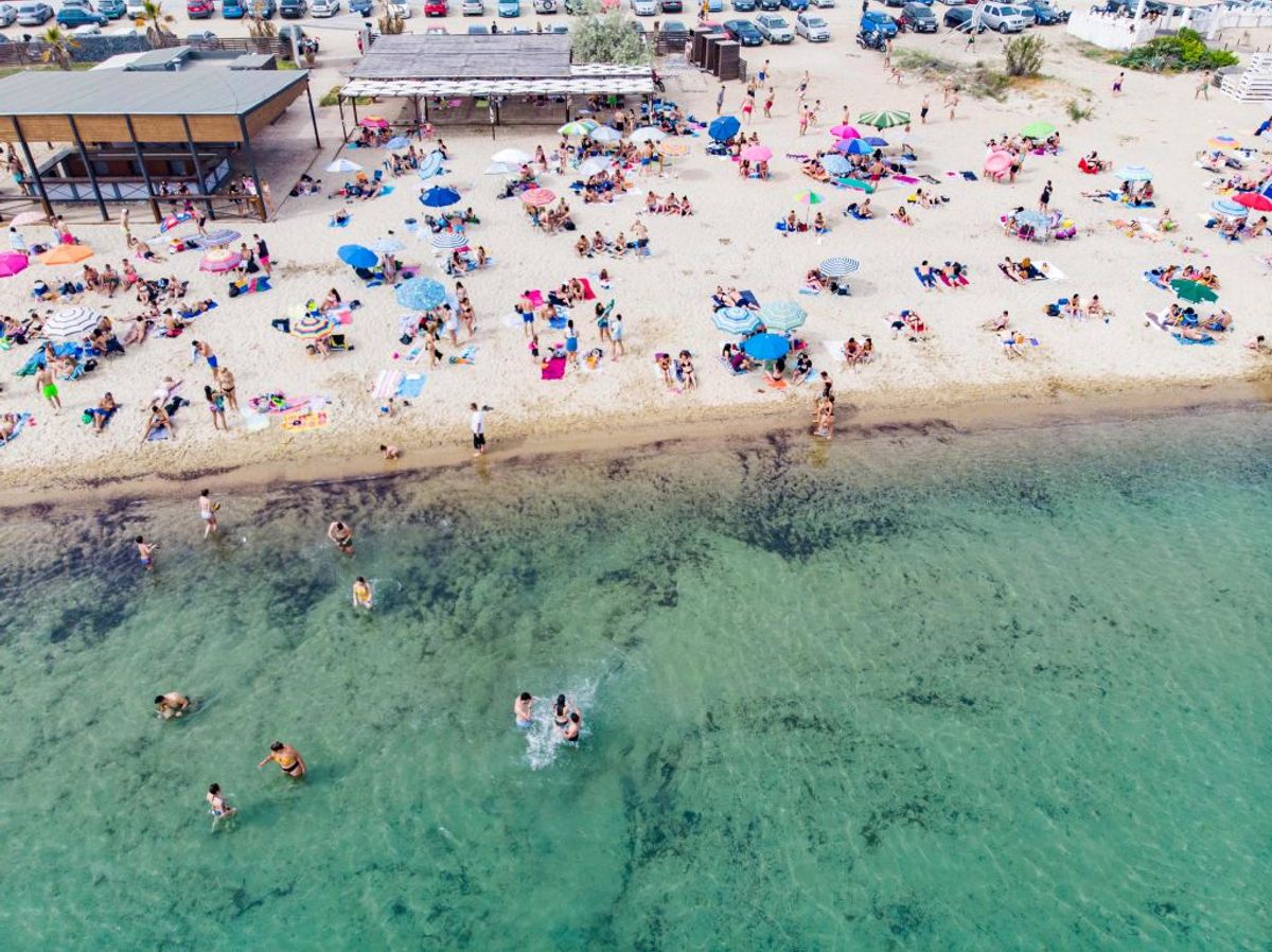 Aerial view from a drone of people at the overcrowded beach of Potamos in Epanomi during a heatwave