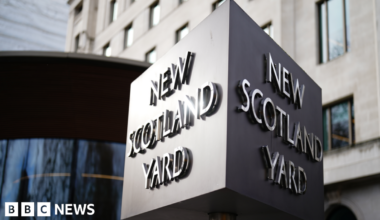 Large cube sign of New Scotland Yard outside the Met HQ