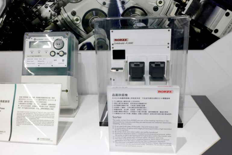 A miniature size wafer sorters machine model by Rorze on display at the Science park exploration museum in Hsinchu, Taiwan, February 6, 2023. REUTERS/Ann Wang