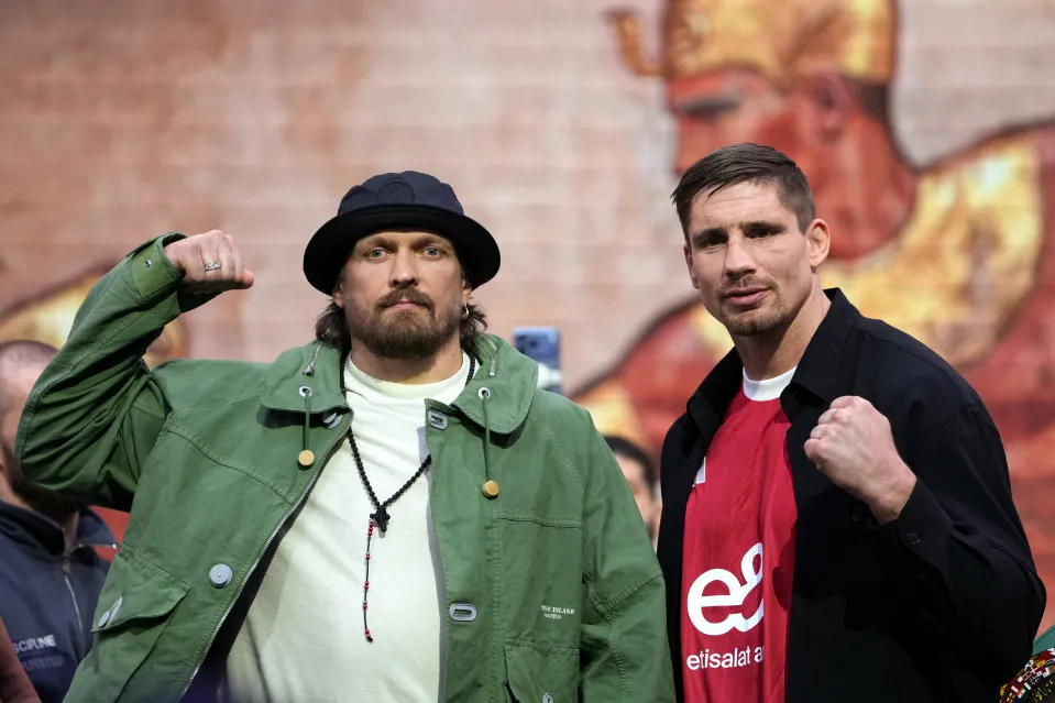 Ukraine's Oleksandr Usyk (L) and Netherlands' Rico Verhoeven attend a press conference, in east London on April 14, 2026, ahead of their WBC World Heavyweight Championship 'Glory in Giza' boxing match, taking place on May 23, 2026 in Egypt