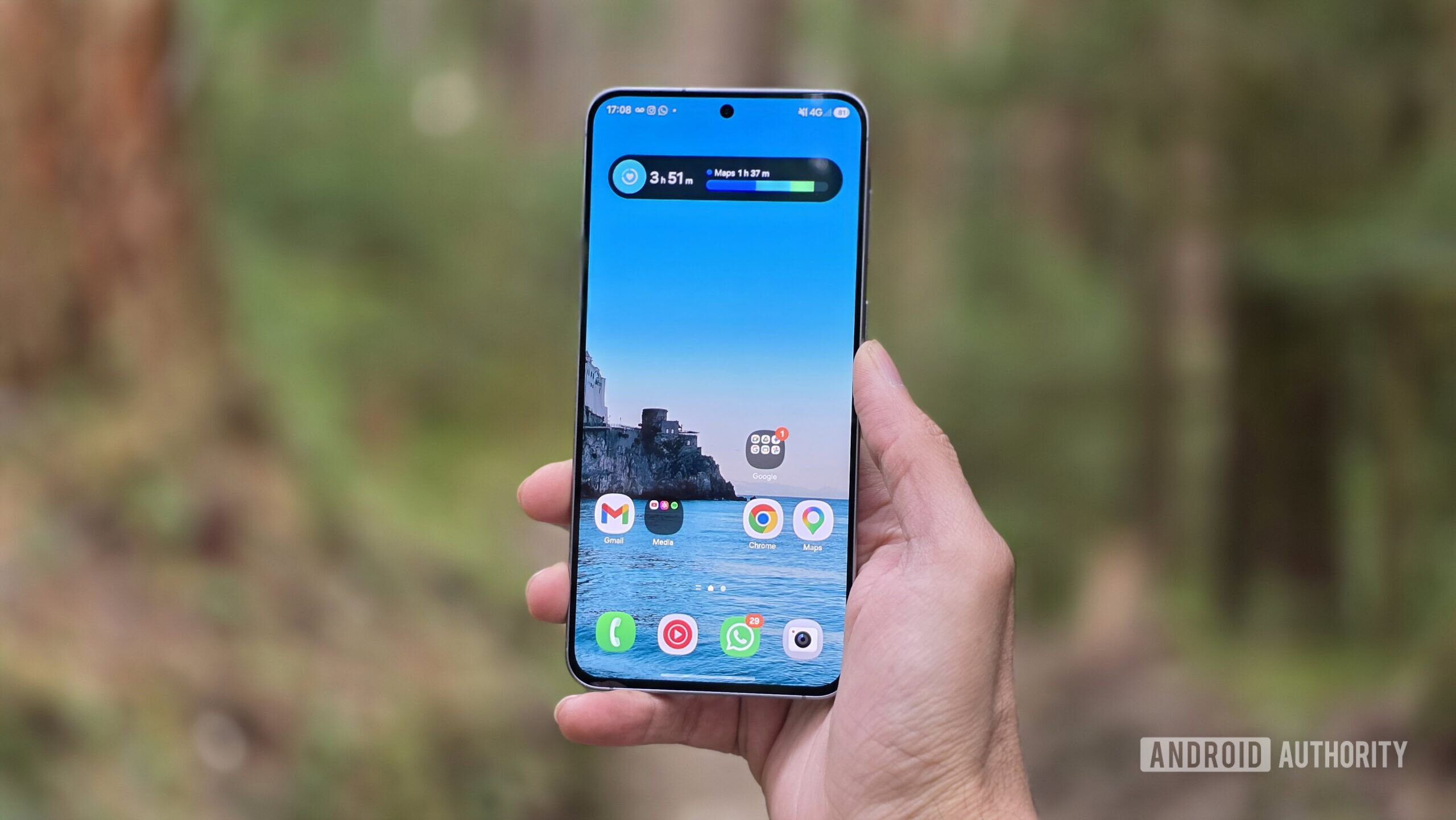 Samsung Galaxy A57 review image 18 Samsung Galaxy A57 review image showing the phone in hand in an outdoor setting