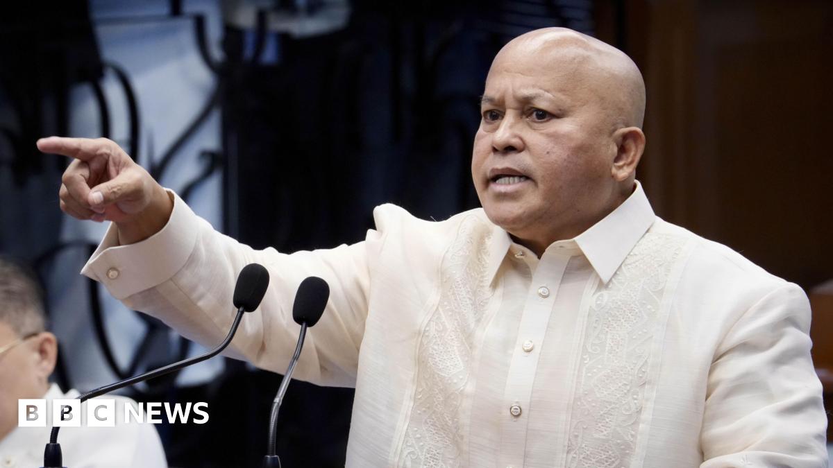 Philippine senator Ronald Bato Dela Rosa speaks from a podium on the Senate floor