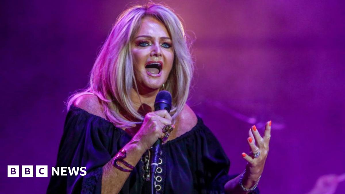 Bonnie Tyler singing into the microphone