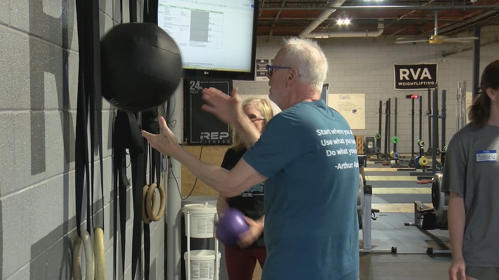Participants exercising during class designed for people with Parkinson's disease