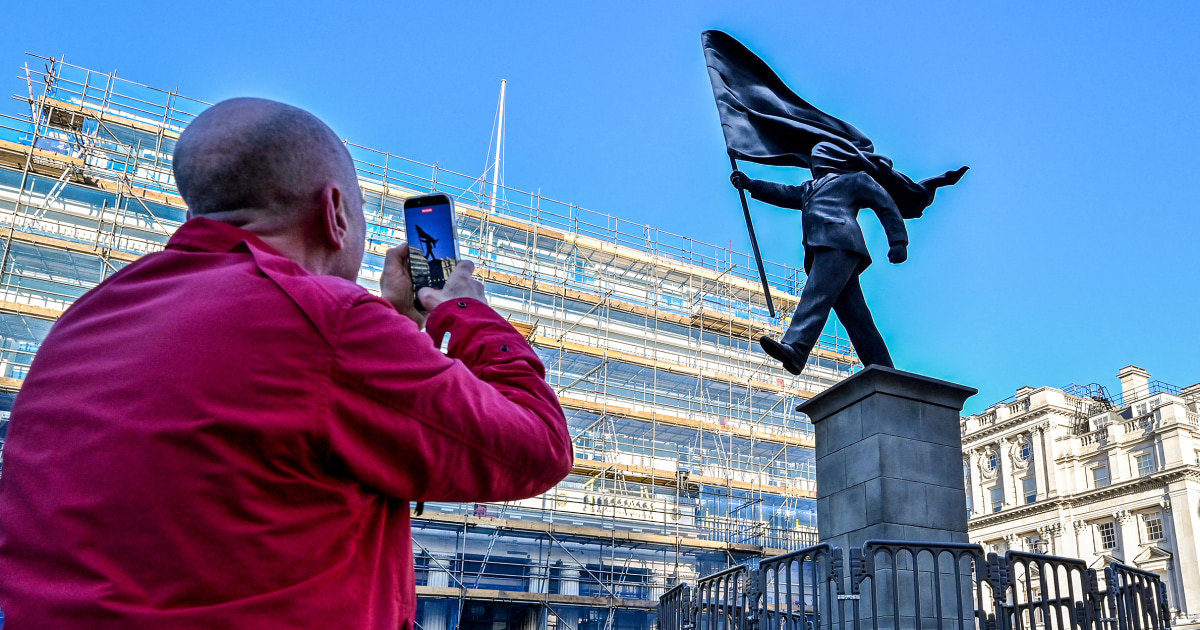 Banksy unveils a new statue in central London of a man blinded by a flag