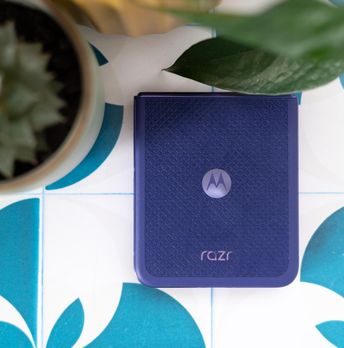 Motorola Razr Ultra 2026 on a tile background showing orient blue color option
