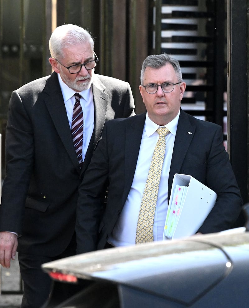 Sir Jeffrey Donaldson leaves Newry Crown Court with his solicitor John McBurney  at the end of the first week of his trial where he stands accused of serious historic sexual offences against two women.