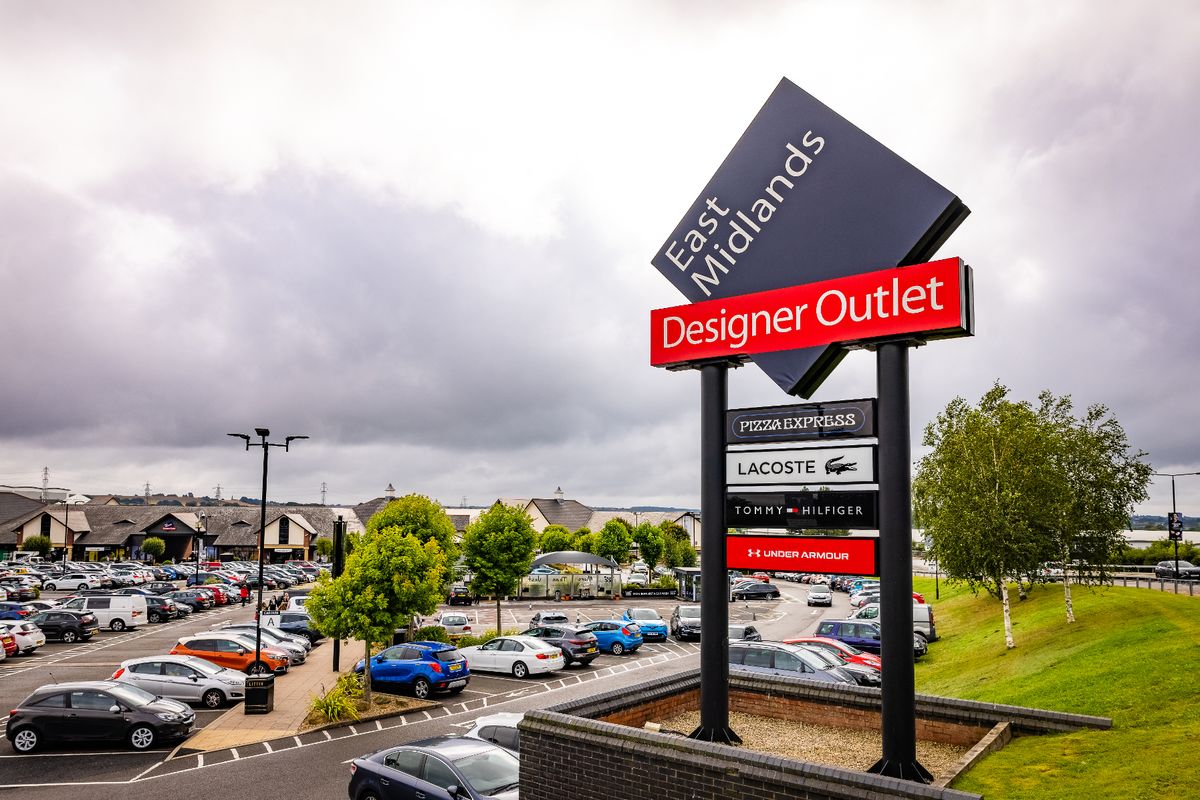 Photo shows the entrance to East Midlands Designer Outlet