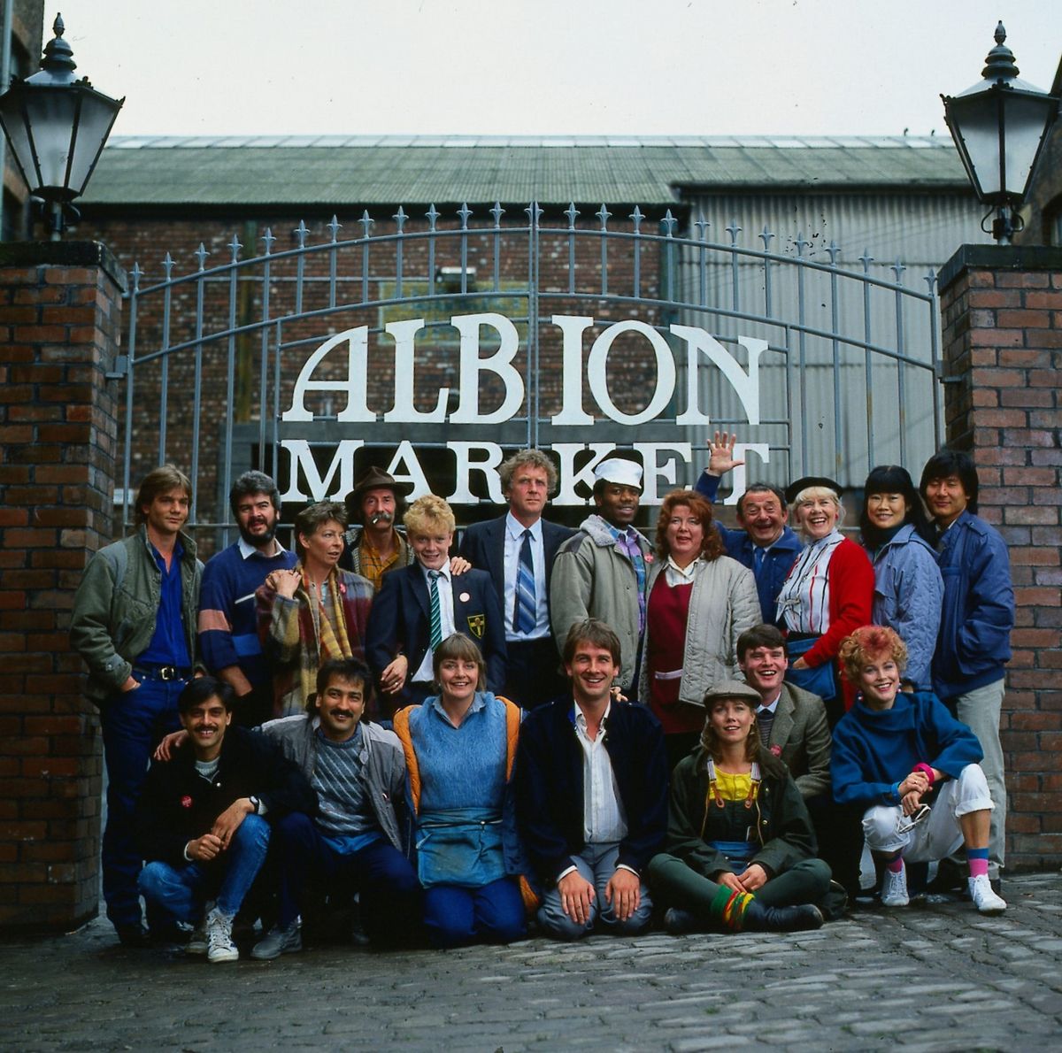 The cast of Albion Market in front of the market gate in 1986