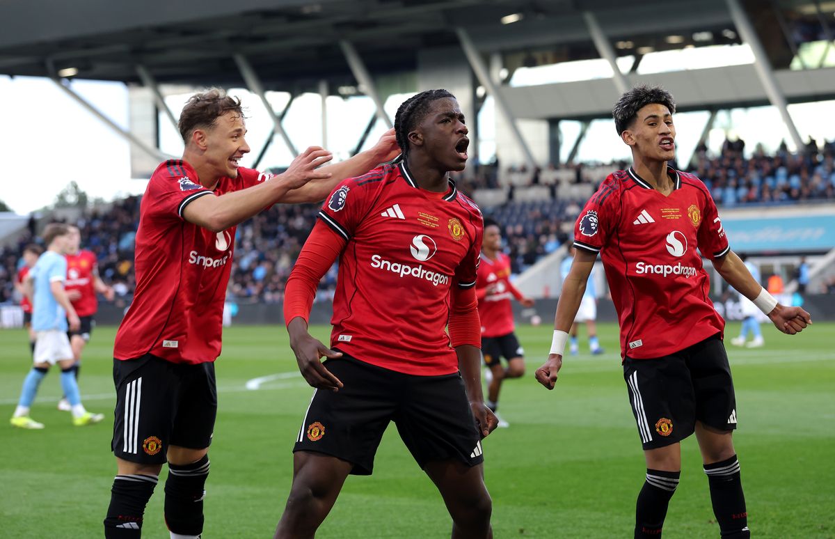 MANCHESTER, ENGLAND - MAY 14: Godwill Kukonki of Manchester United celebrates scoring his team's first goal with teammates Amir Ibragimov and JJ Gabriel during the FA Youth Cup Final match between Manchester City and Manchester United at Joie Stadium on May 14, 2026 in Manchester, England. (Photo by Alex Livesey - The FA/The FA via Getty Images)