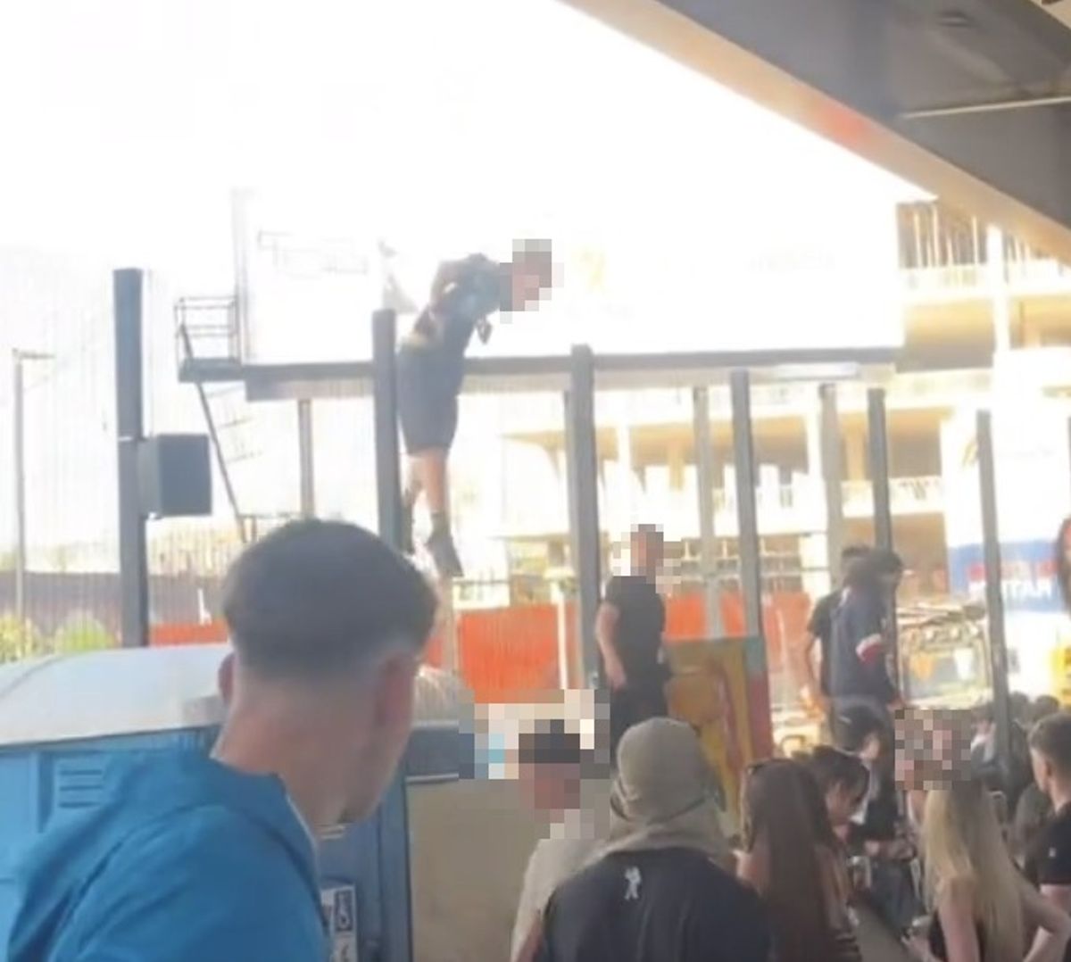 People were seen being 'angry' outside before trying to climb the fence